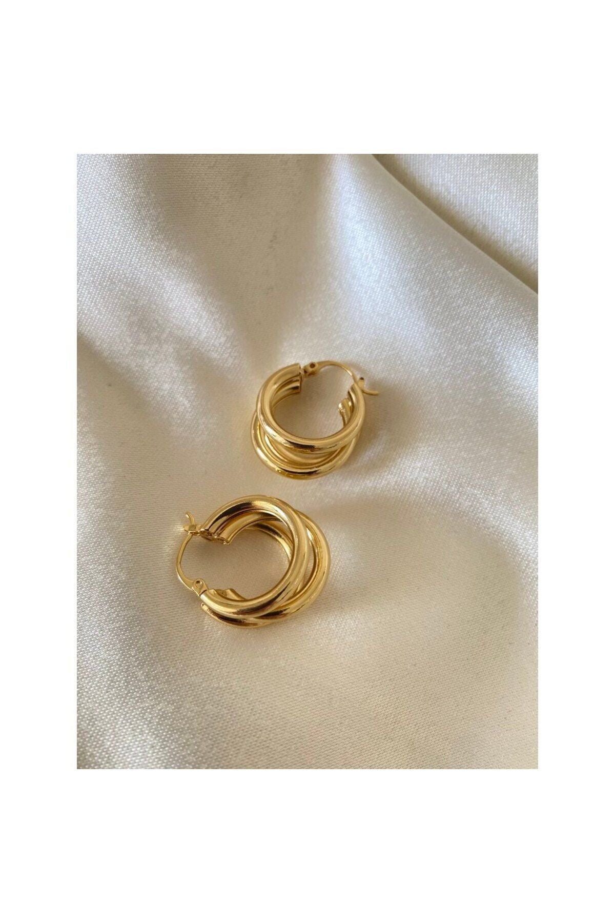 Üçlü görünümlü gold çelik küpe